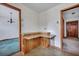 Built-in wood cabinets between two doorways with tile floors at 7659 Allwood Ave, North Charleston, SC 29418