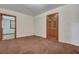 Room with carpet, door and doorway to other rooms at 7659 Allwood Ave, North Charleston, SC 29418