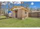 Charming brick shed in a well-maintained backyard, offering additional storage and functionality at 7659 Allwood Ave, North Charleston, SC 29418