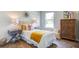 Stylish bedroom featuring a comfortable bed, two bedside tables, and a chest of drawers at 8018 Rackham Rd, Hollywood, SC 29470
