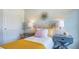 Well-lit bedroom with a plush bed, two nightstands with lamps, and closet at 8018 Rackham Rd, Hollywood, SC 29470