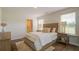 Comfortable bedroom featuring a neutral color scheme, plush bedding, and an en-suite bathroom at 8018 Rackham Rd, Hollywood, SC 29470