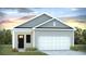 Charming single-Gathering home with a well-manicured lawn and an attached two-car garage at 8018 Rackham Rd, Hollywood, SC 29470
