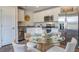 Kitchen with hardwood floors, stainless steel appliances, white cabinets, and a kitchen table at 8018 Rackham Rd, Hollywood, SC 29470