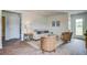 Cozy living room features hardwood floors, a comfortable sofa, and wicker chairs at 8018 Rackham Rd, Hollywood, SC 29470