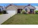 Charming single-Gathering home with a well-manicured lawn, two car garage and inviting curb appeal at 8506 Kennestone Ln, North Charleston, SC 29420