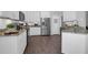 Bright, updated kitchen with stainless steel appliances, granite counters and white cabinets at 8506 Kennestone Ln, North Charleston, SC 29420