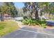 Neighborhood playground with climbing structure surrounded by mature trees and green space at 8506 Kennestone Ln, North Charleston, SC 29420