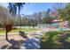 Community playground and tennis courts surrounded by lush greenery and mature trees at 8506 Kennestone Ln, North Charleston, SC 29420