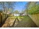 Large, fenced backyard with a covered patio perfect for entertaining at 914 King Richard Dr, Charleston, SC 29407