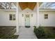 Inviting front entrance with a modern light blue door and stylish sconces at 914 King Richard Dr, Charleston, SC 29407