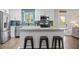 Modern kitchen featuring stainless steel appliances, island, and blue tile backsplash at 914 King Richard Dr, Charleston, SC 29407