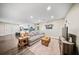 Open concept living room featuring hardwood floors and adjoins the kitchen at 914 King Richard Dr, Charleston, SC 29407