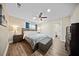 Cozy main bedroom with a ceiling fan, natural light, and en suite bathroom at 914 King Richard Dr, Charleston, SC 29407