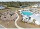 Aerial view of the community pool, playground and pond at 103 Cotesworth Ct, Summerville, SC 29486