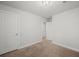 Simple bedroom featuring neutral carpet, two doors, and freshly painted walls at 103 Cotesworth Ct, Summerville, SC 29486