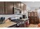 Modern kitchen featuring granite countertops, stainless steel microwave and gas range, and white subway tile backsplash at 103 Cotesworth Ct, Summerville, SC 29486