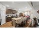 Open-concept kitchen with granite countertops, bar stool seating, stainless steel appliances and adjacent dining space at 103 Cotesworth Ct, Summerville, SC 29486
