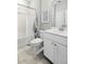 Clean bathroom features a shower-tub combo with white tile and a white vanity with silver fixtures at 1047 Tea Time Dr, Summerville, SC 29485
