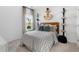 Cozy bedroom with decorative shelving, an anchor light, and a serene window view at 1047 Tea Time Dr, Summerville, SC 29485