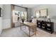 Bright home office featuring a modern wooden desk, ample natural light, and stylish decor for a productive workspace at 1047 Tea Time Dr, Summerville, SC 29485