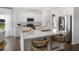 Bright kitchen with white cabinetry, stainless steel appliances, and a center island with bar seating at 1047 Tea Time Dr, Summerville, SC 29485