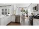 Well-lit open kitchen with stainless-steel appliances, ample countertop space, and a view of dining area at 1047 Tea Time Dr, Summerville, SC 29485