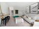 Stylish living room with a rope swing bar, plush seating, and ship lap accent wall at 1047 Tea Time Dr, Summerville, SC 29485