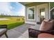 Relaxing patio seating area with a serene view of lush green spaces, perfect for enjoying nature at 1047 Tea Time Dr, Summerville, SC 29485
