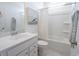 Clean, bright bathroom featuring a shower-tub combo, vanity with a white countertop, and marble floors at 1058 Tea Time Dr, Summerville, SC 29485