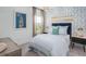 Charming bedroom boasts patterned wallpaper, natural light, and a nautical-themed decor at 1058 Tea Time Dr, Summerville, SC 29485