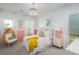 Cozy bedroom features pink accents, a stylish light fixture, and plush furnishings at 1058 Tea Time Dr, Summerville, SC 29485