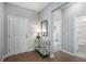 Bright entryway with wood floors, stylish console table, and views into the bedroom and bathroom at 1058 Tea Time Dr, Summerville, SC 29485