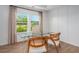 Bright home office featuring a glass desk, comfortable chairs, and a large window with a scenic view at 1058 Tea Time Dr, Summerville, SC 29485