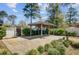 Relaxing backyard patio with a gazebo and lush landscaping at 107 Minus St, Saint George, SC 29477