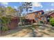The backyard features mature trees, hedges, and a detached garage offering a serene and private outdoor space at 107 Minus St, Saint George, SC 29477