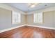 Bedroom with two windows and hardwood floors at 107 Minus St, Saint George, SC 29477