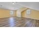 Large bonus room with wood-look flooring, two windows and plenty of light at 107 Minus St, Saint George, SC 29477