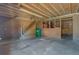 Unfinished garage with stairs and plenty of potential for workshop or storage at 107 Minus St, Saint George, SC 29477