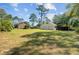View of a detached garage and expansive backyard, perfect for recreation and relaxation at 107 Minus St, Saint George, SC 29477