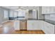 Bright and airy kitchen featuring stainless steel appliances, ample countertop space and hardwood floors at 107 Minus St, Saint George, SC 29477