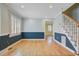 Bright living room with hardwood floors, large windows, and access to other rooms at 107 Minus St, Saint George, SC 29477