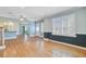 Large, bright living room with hardwood floors, chair railing, and access to other rooms at 107 Minus St, Saint George, SC 29477
