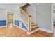 Classic staircase with wooden banister and hardwood steps at 107 Minus St, Saint George, SC 29477
