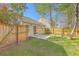 Secluded backyard with a green lawn, privacy fence, and patio, perfect for entertaining at 108 Chemistry Cir, Ladson, SC 29456