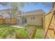 Well-maintained backyard with a privacy fence, patio area, and garden at 108 Chemistry Cir, Ladson, SC 29456