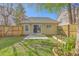 Lush backyard with a garden, concrete patio, and fenced-in area, ideal for outdoor living at 108 Chemistry Cir, Ladson, SC 29456
