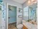 Well-lit bathroom with shower-tub, toilet, and closet with shelving at 108 Chemistry Cir, Ladson, SC 29456