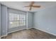 Cozy bedroom with hardwood floors, ceiling fan, and a window offering natural light at 108 Chemistry Cir, Ladson, SC 29456