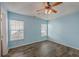 This bright bedroom features wood flooring and large windows for natural light at 108 Chemistry Cir, Ladson, SC 29456